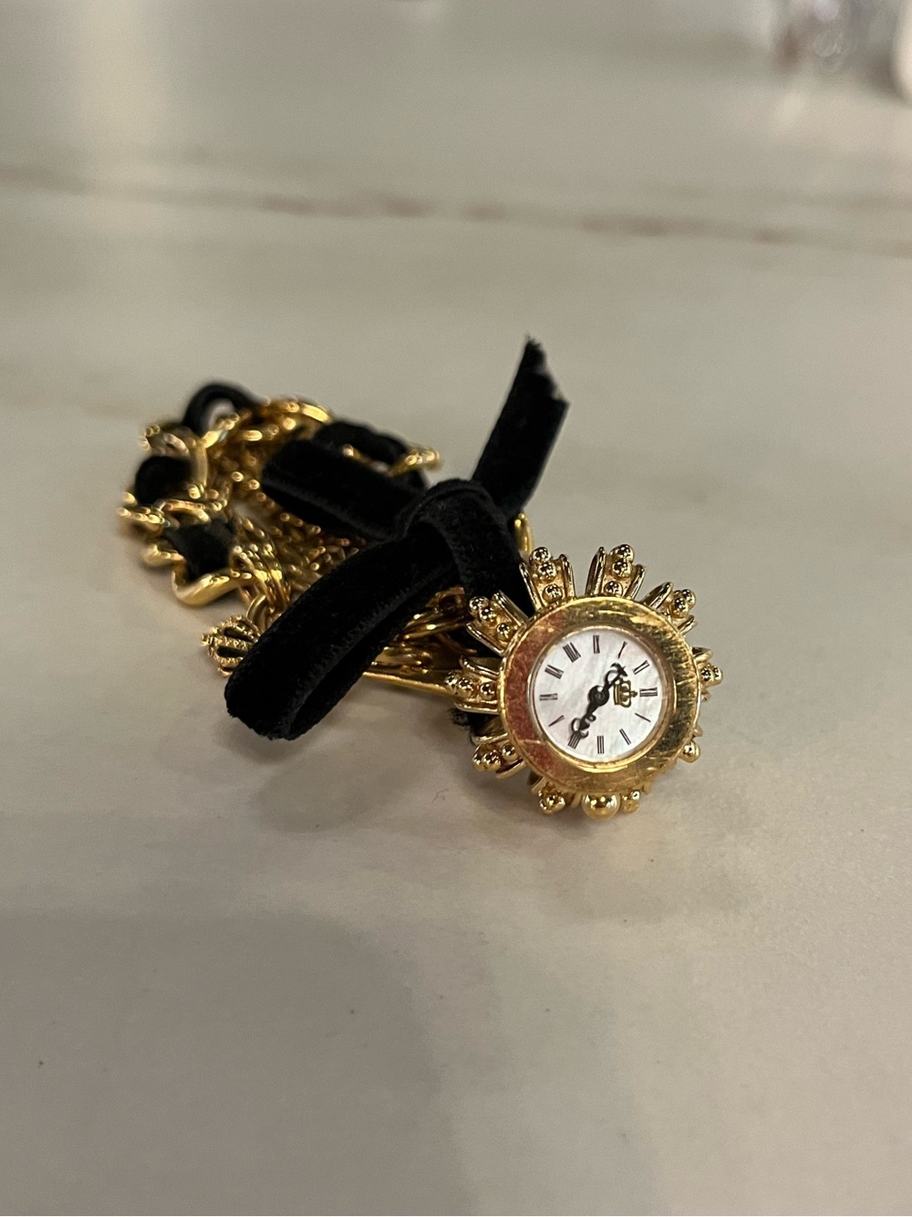 Juicy Couture Gold Sunburst Charm Watch Bracelet with Black Ribbon